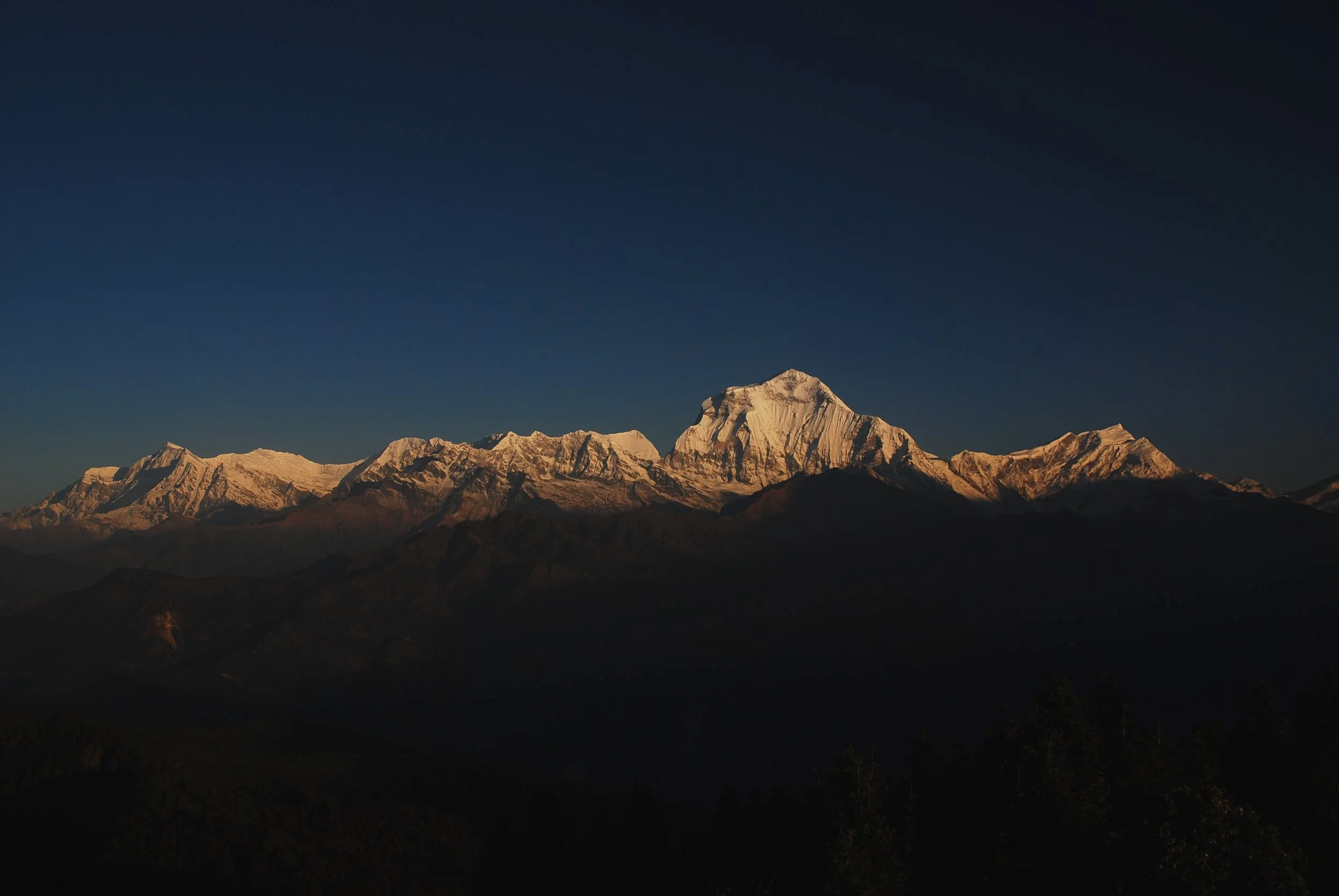 The Himalayan skyline as viewed from Poon Hill in Nepal at sunrise