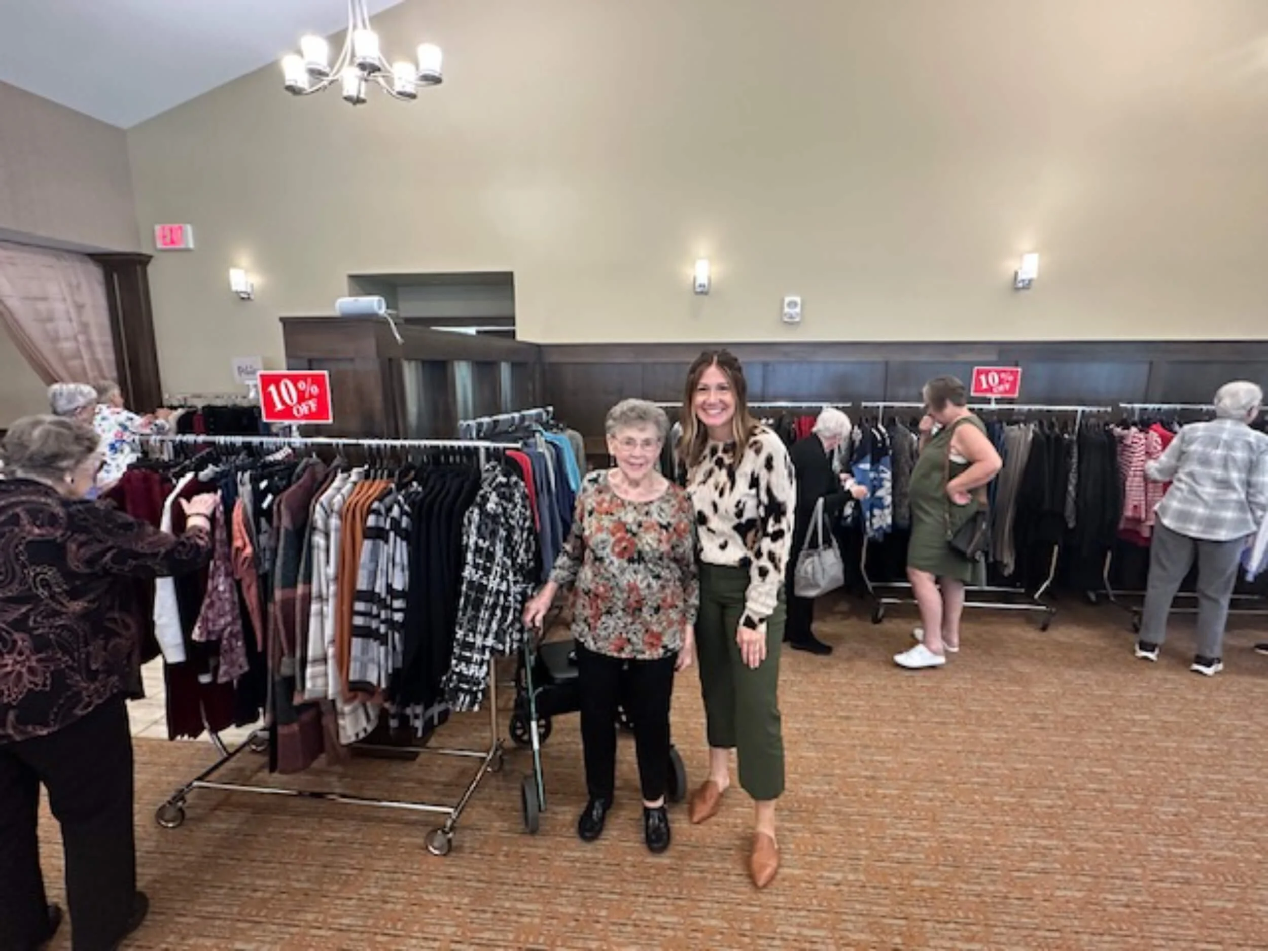 Chosen Threads Boutique owner Nicole Steckler posing with customer.
