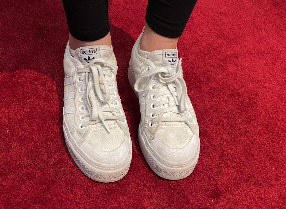 white sneakers on red carpet