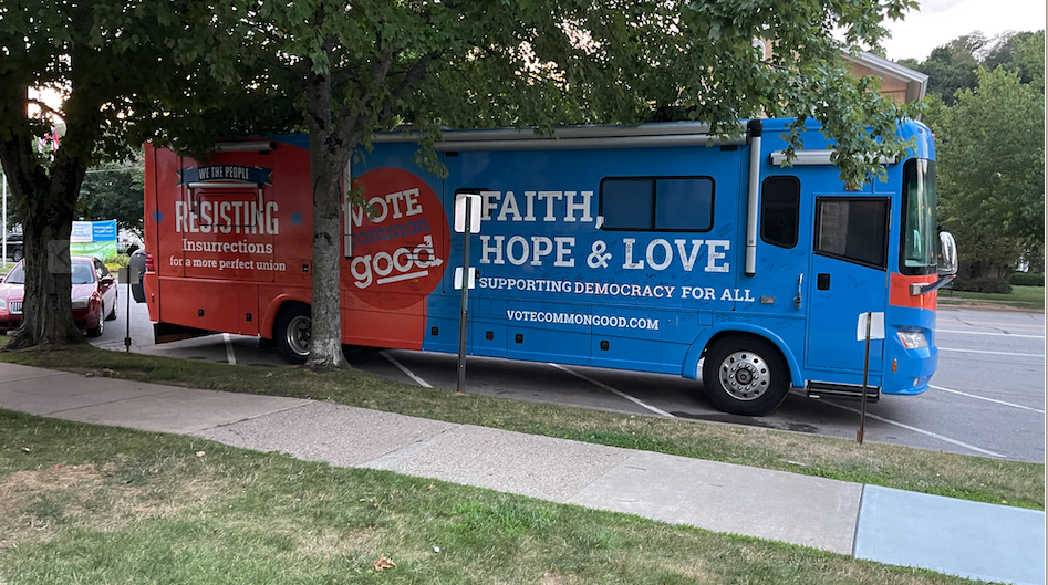 Vote Common Good bus in front of church 