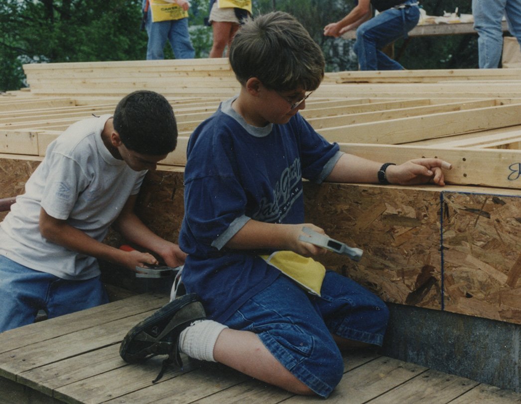 Two boys working on building a Habitat House