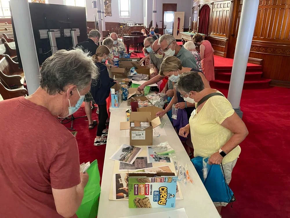 filling bags for homeless folks after a service