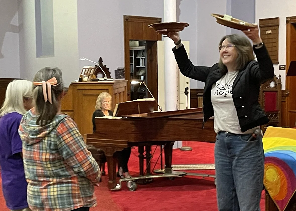 Pastor Alissia offering up to God, piano with Jackie and ushers in front