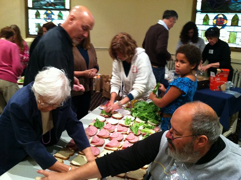 making sandwiches for lunches on the square