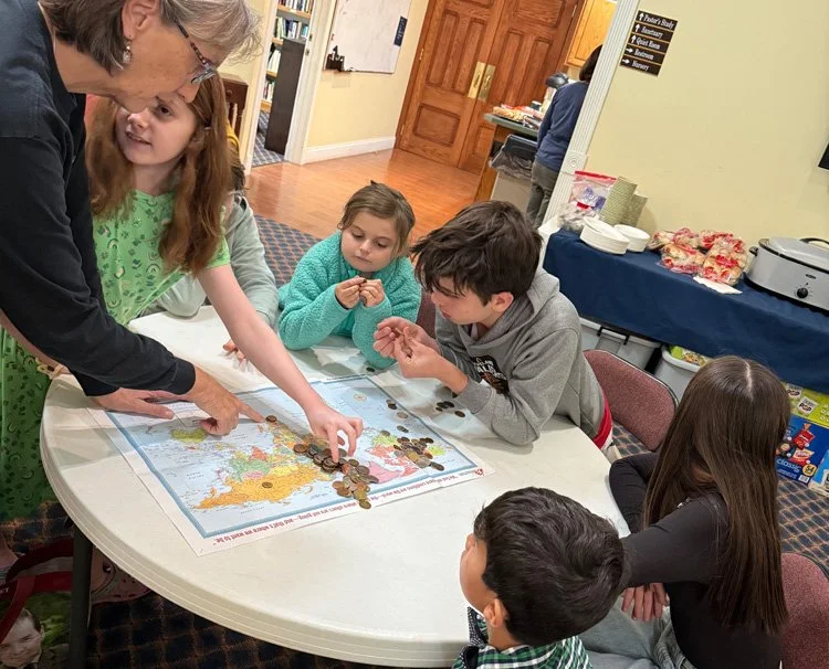 children counting noisy offering coins and choosing recipients