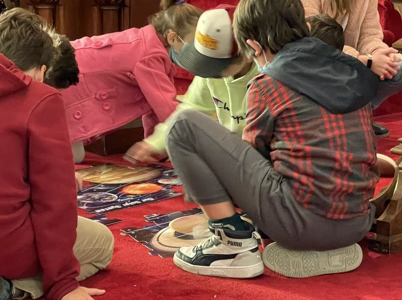 children putting puzzle together in church
