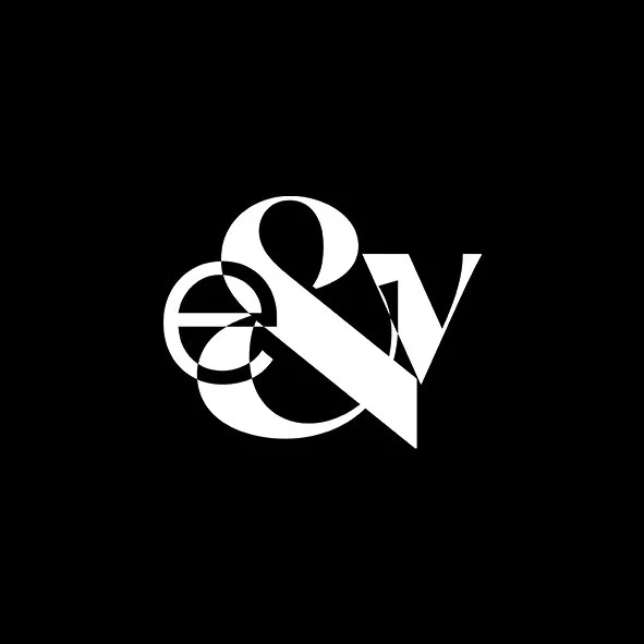 Black background with white stylized ampersand and the letter 'V'.