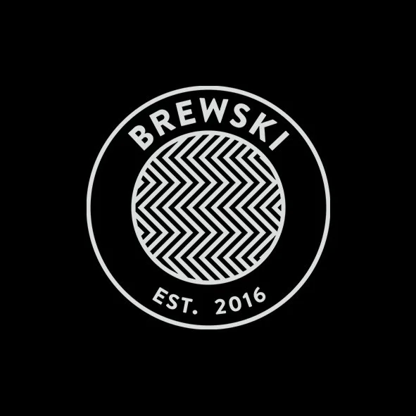Logo for Brewski, established in 2016, featuring a circular design with a patterned center and text around it on a black background.