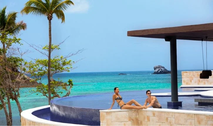 Luxury all-inclusive resort pool overlooking the Caribbean Sea in St. Lucia