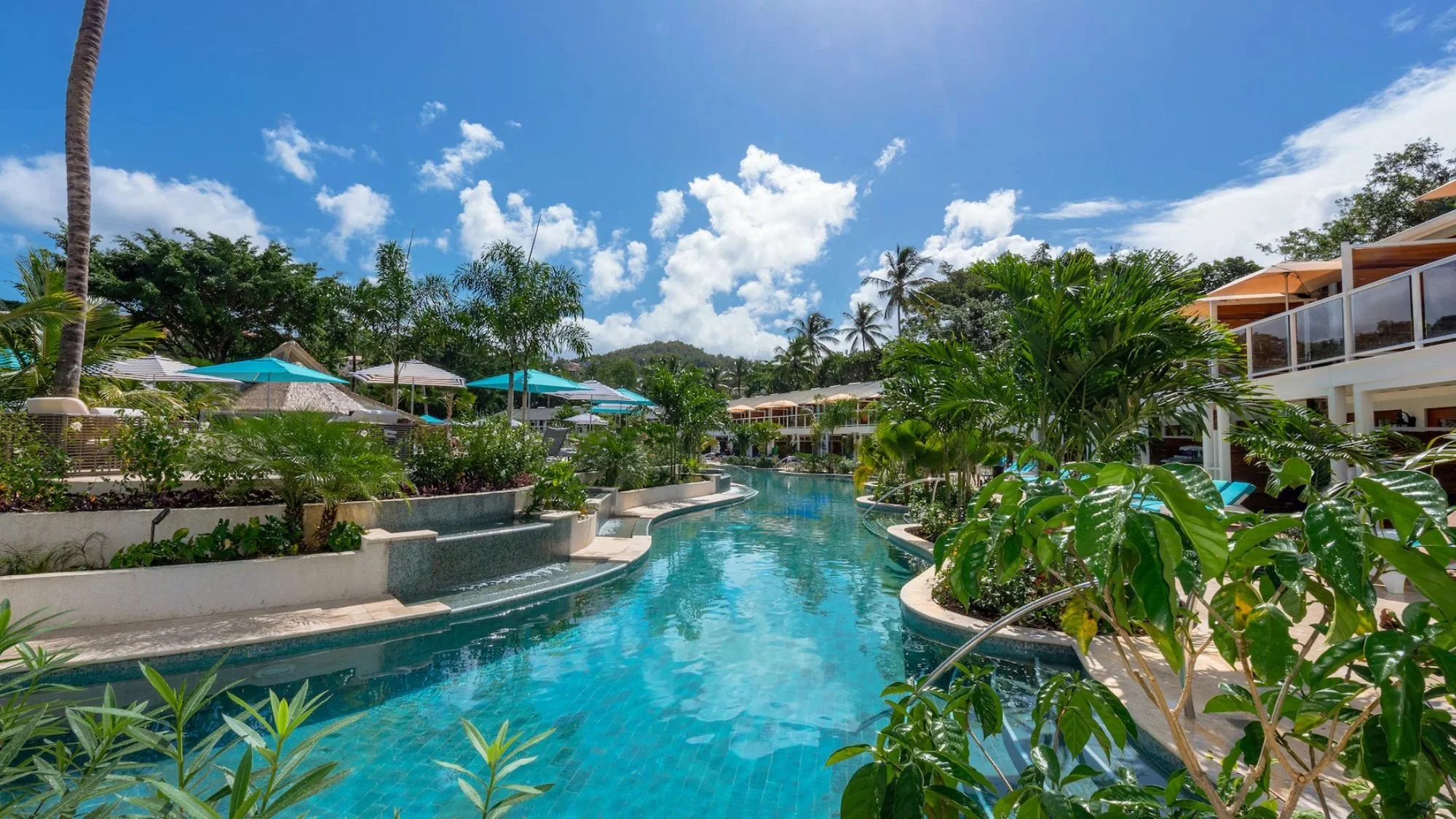 Lush lagoon pool at a tropical resort in St. Lucia