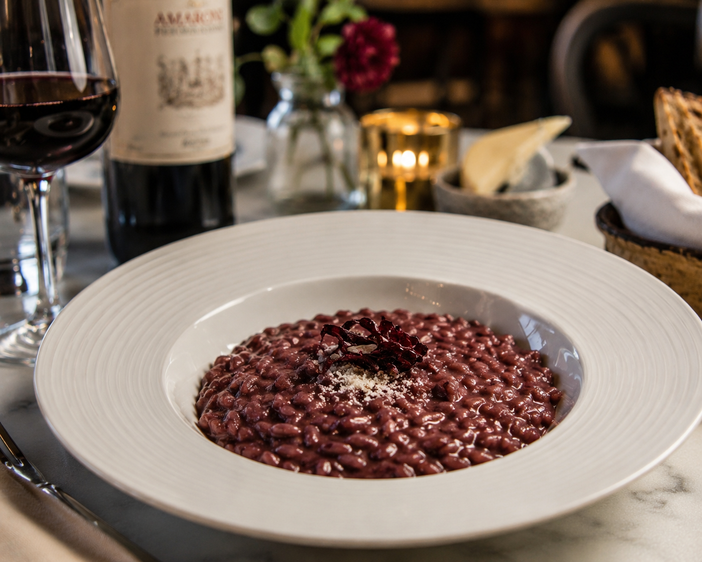 Risotto all'Amarone in a white dish on table in restaurant