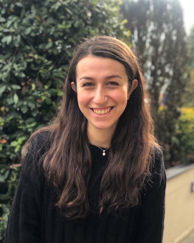 woman in black shirt, smiling