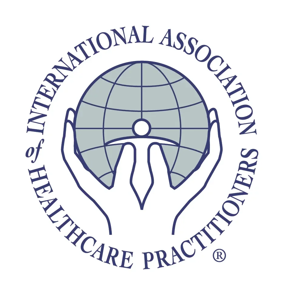Logo of the International Association of Healthcare Practitioners featuring a globe held by two hands for CranialSacral Therapy certification at Spirit Well Sensory Lounge in Stuart, Florida.