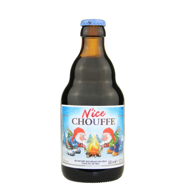 A brown beer bottle with a blue cap featuring a Christmas-themed label depicting two gnomes wearing Santa hats, roasting marshmallows over a campfire, with snow and pine trees in the background, labeled 'Nice Chouffe'.