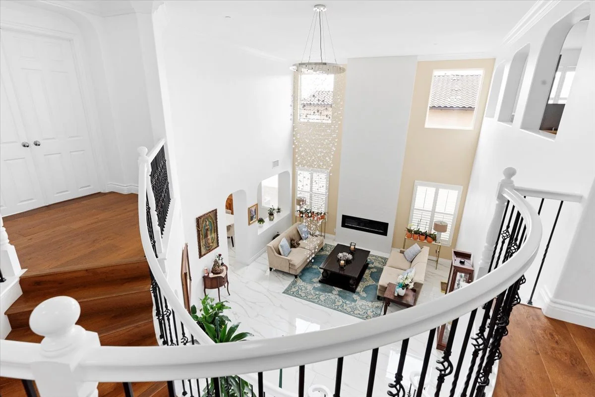 Luxury curved staircase two story foyer real estate photography north Rancho Cucamonga CA SoCal Home Photo