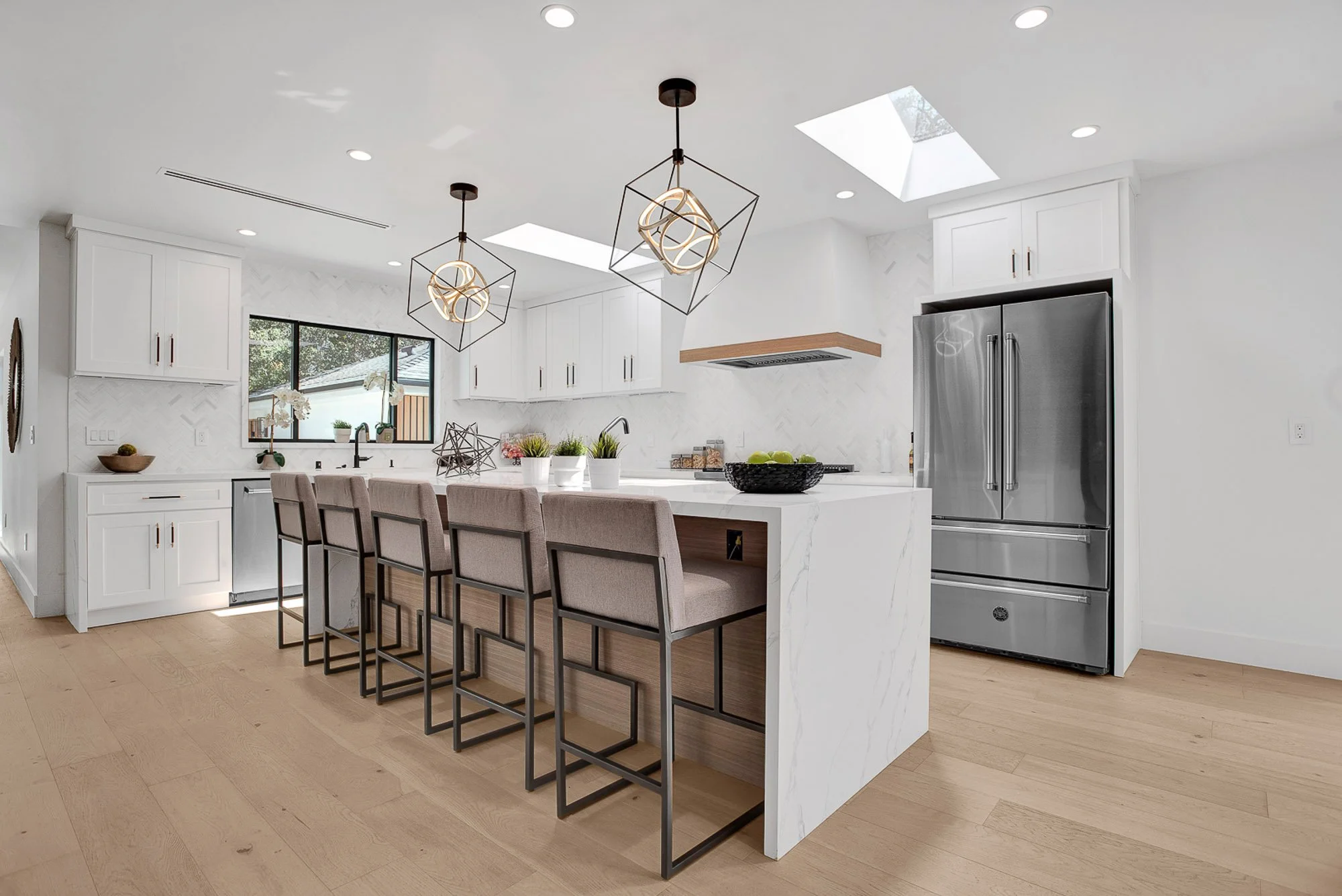 Wide-angle view of a modern kitchen with quartz countertops in a Rialto, CA home. Professional real estate photography by SoCal Home Photo, providing high-end listing media for agents in the Inland Empire.