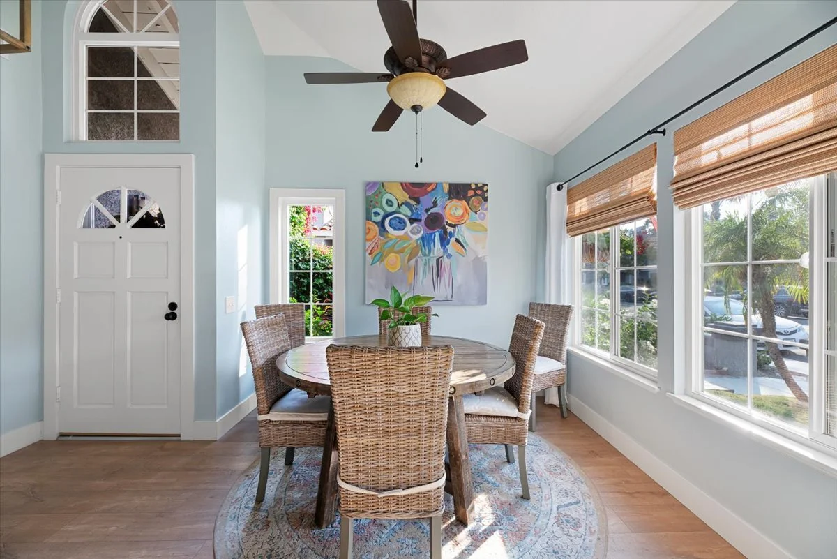 Light blue dining room with colorful artwork real estate photography Ontario CA SoCal Home Photo