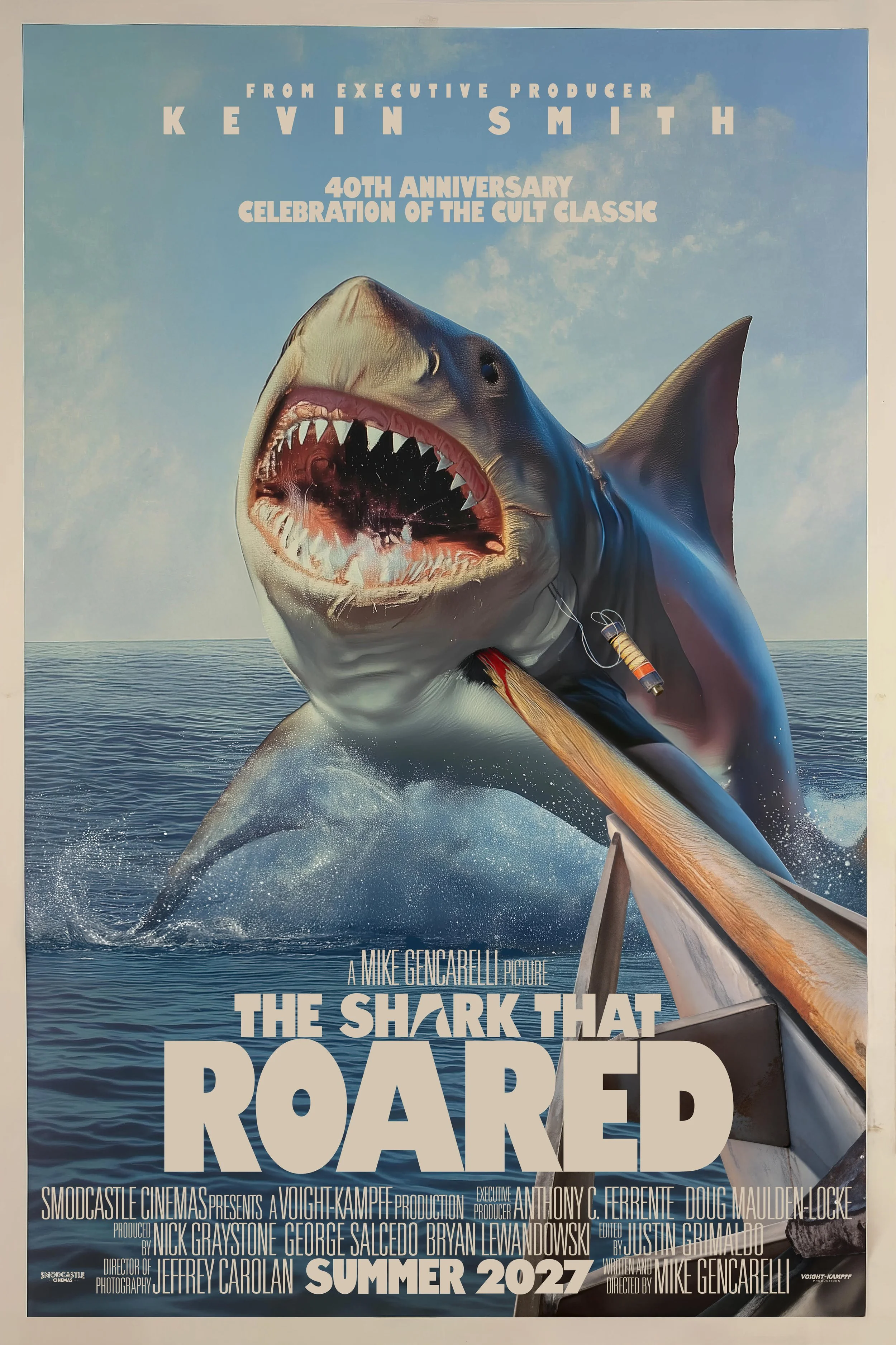A movie poster for the film "The Shark That Roared" featuring a giant shark with an open mouth showing sharp teeth and a prosthetic device attached, jumping out of the ocean with a rowboat at the bottom of the poster. The poster includes text about a 40th anniversary celebration and summer 2027 release, with credits and production details.