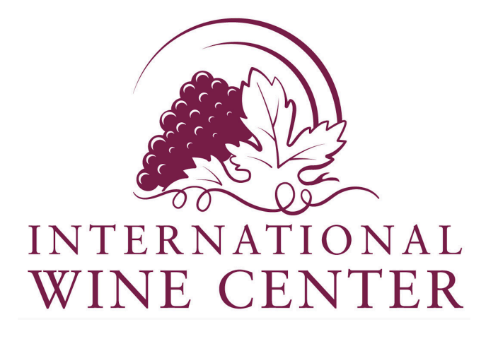 Logo of International Wine Center with a cluster of grapes, a grape leaf, and the text 'International Wine Center' in purple.