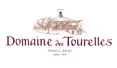 Logo for Domaine des Tourelles winery, featuring an illustration of a building with arches, trees, and a wine glass above, with the winery name in elegant script.