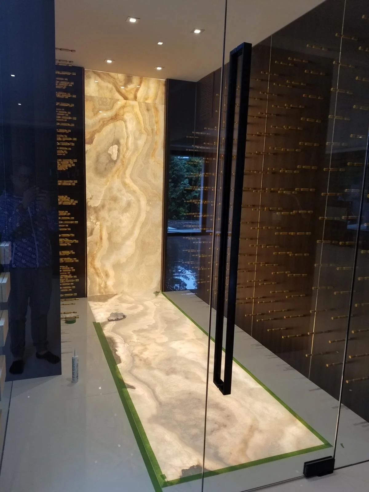 Backlit Onyx Wine Room — Integrated illuminated stone surfaces