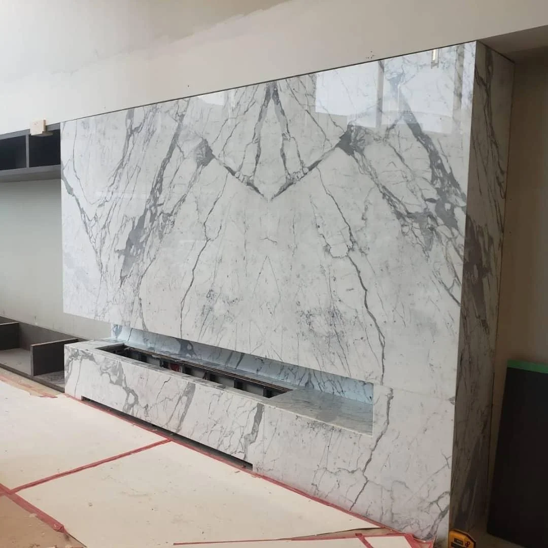 Bookmatched Marble Fireplace — Precision-fabricated full-height surround
