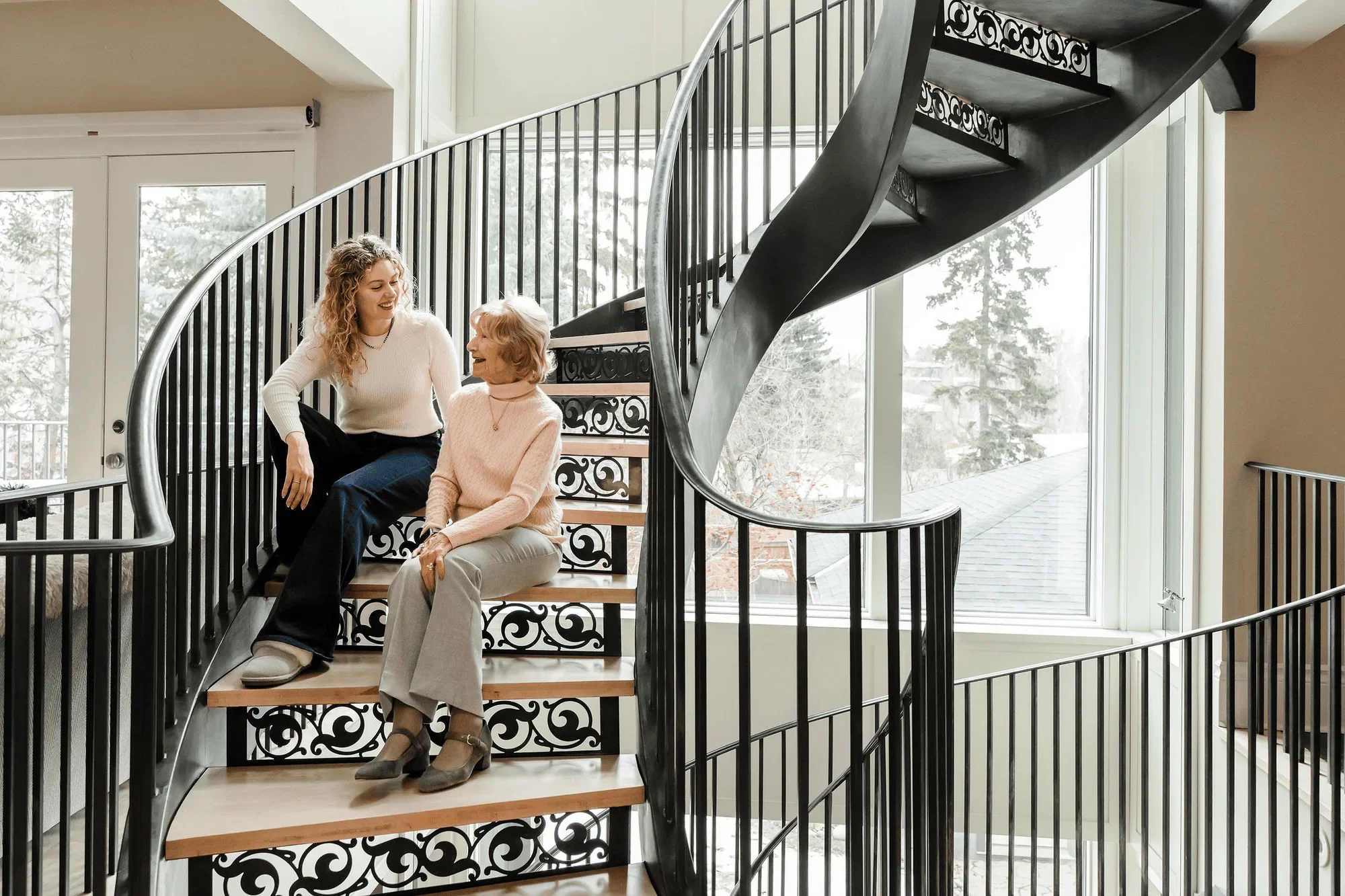 Senior woman smiling with her home care provider in Calgary
