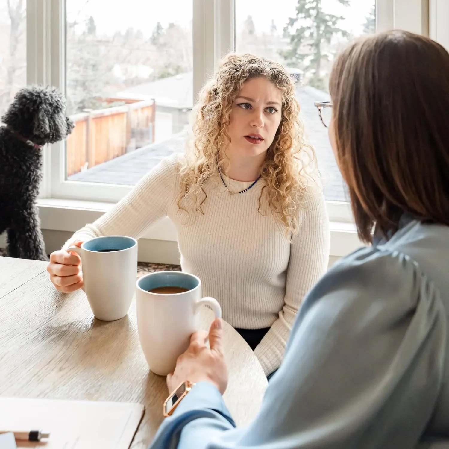 Registered nurse speaking with a family member during respite care in Calgary