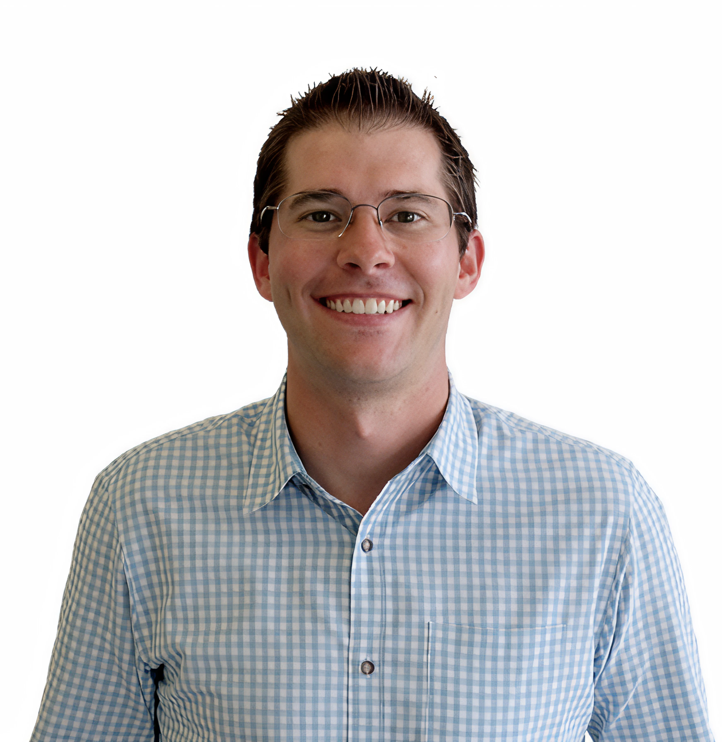 A young man with short dark hair, wearing glasses and a blue and white checkered shirt, smiling against a plain white background.