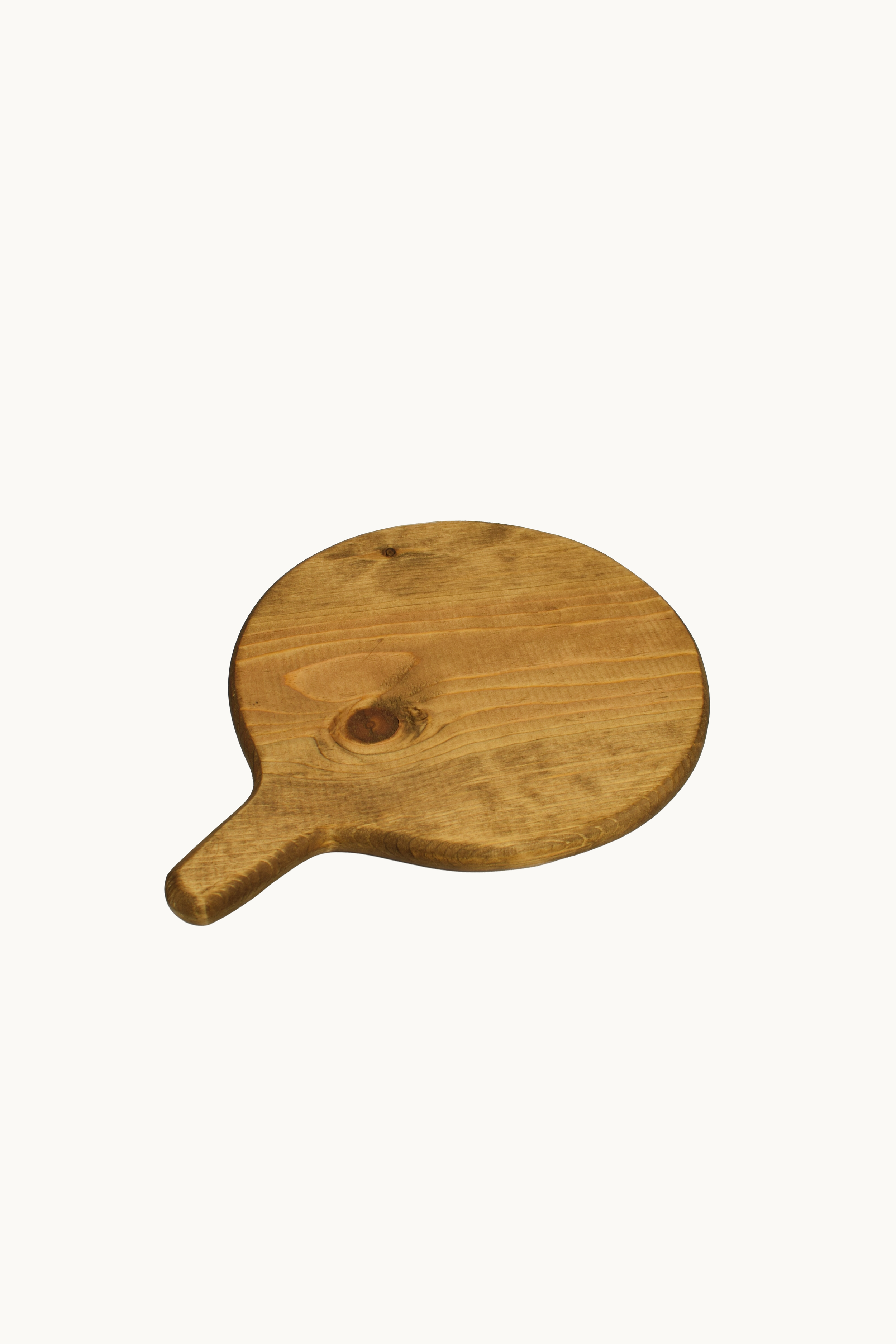 Round walnut serving board included in the Poco Picnic collection