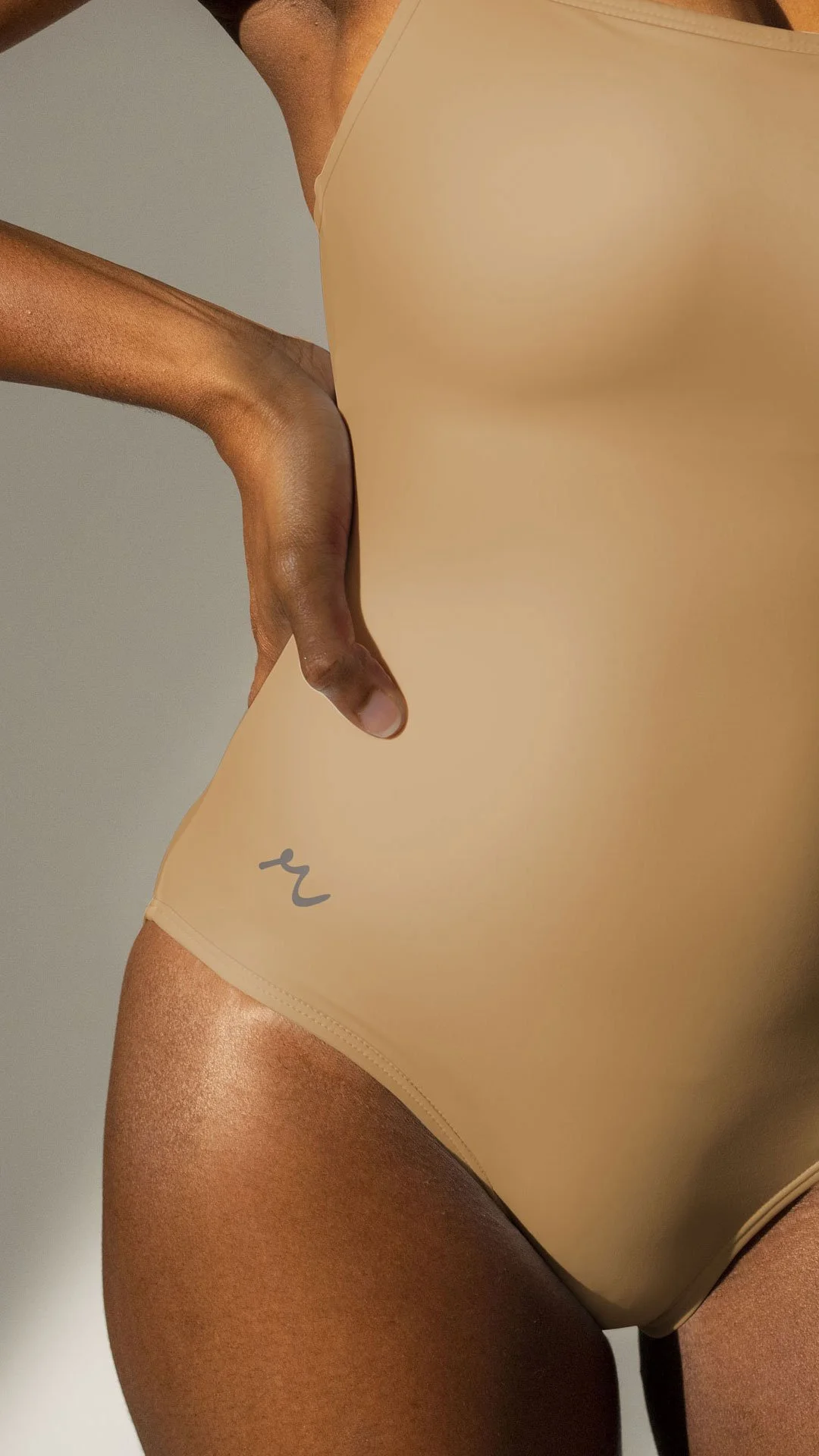 icon mark for revivre swimwear clothing brand in the UK