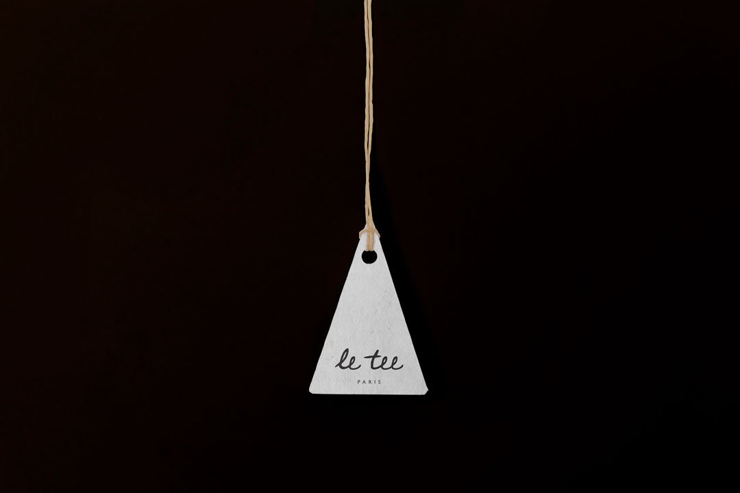 eiffel tower-esque shaped swing tag brand design for le tee paris clothing company