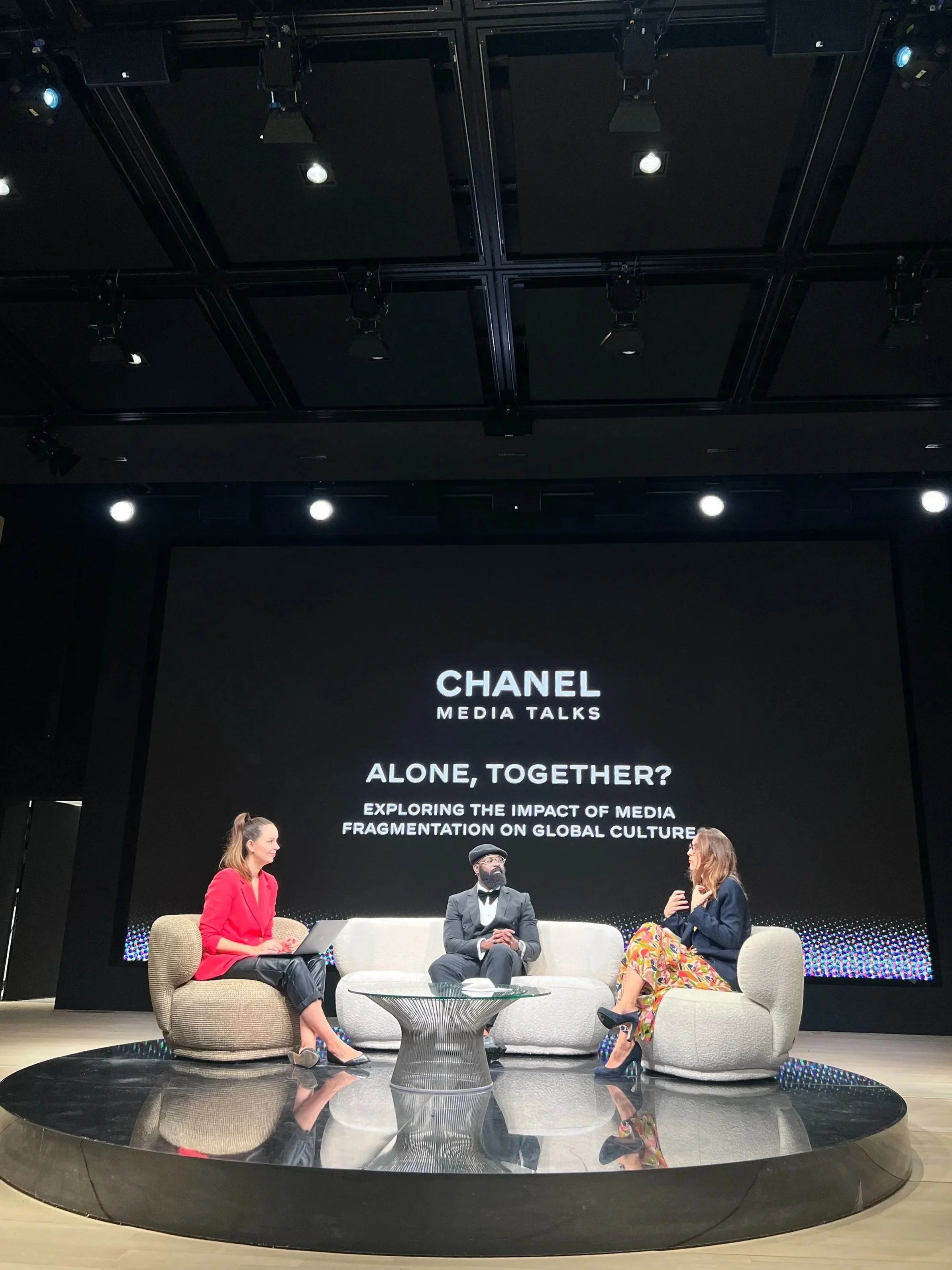 Dr. Adesegun 'King SMADE' Adeosun Jnr. speaking on stage