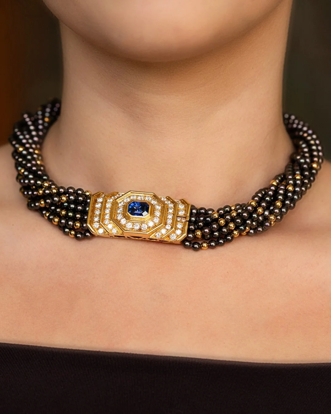 Chaumet multi-strand necklace featuring cultured seed pearls, black pearls, a diamond and a rectangular cabochon Colombian sapphire
