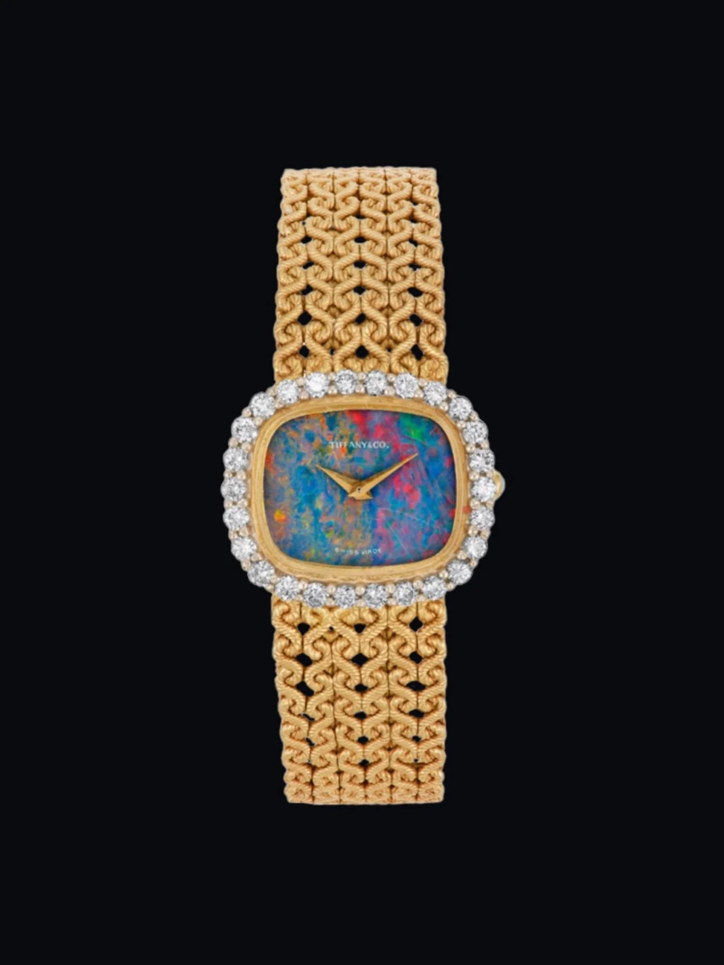 Tiffany &amp; Co. Opal &amp; Diamond Wristwatch
18k (750) gold with opal dial &amp; crown, round diamonds, Tiffany &amp; Co., Swiss made.