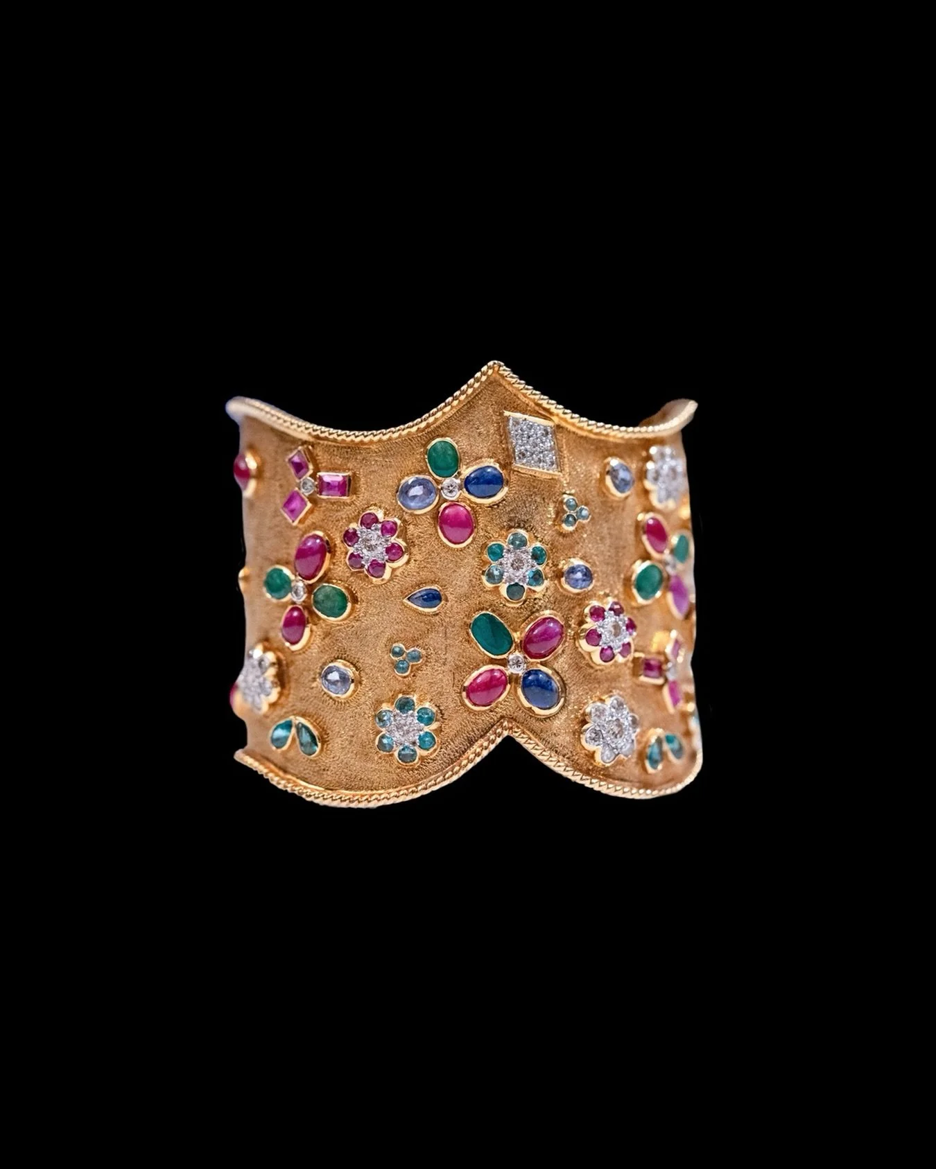 18K gold cuff bangle consisting of Multi-Gem set &amp; diamond, 1960s

Weight 67.28g.