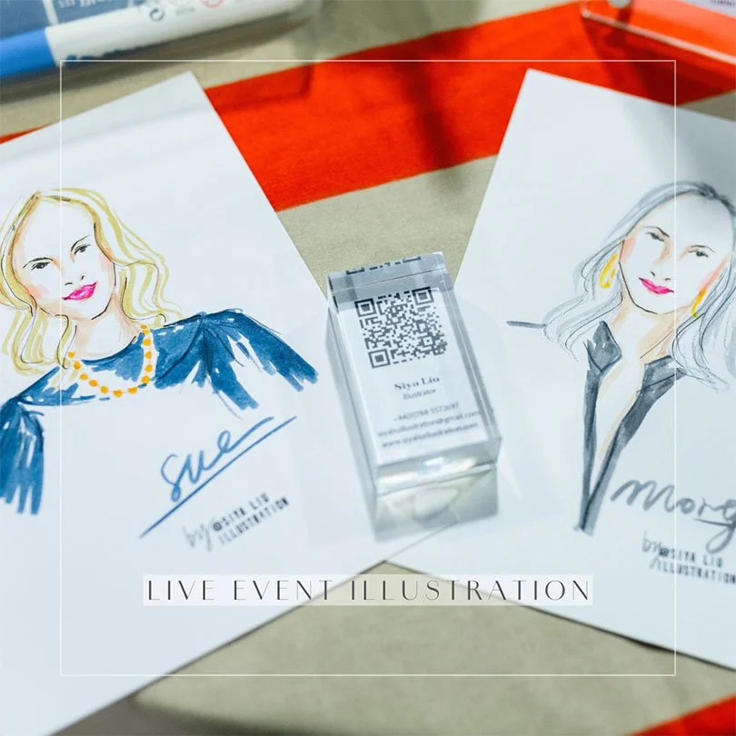 Two personalised fashion portraits are displayed on a live event illustration table at an event hosted by Siya Liu; one portrait of a blonde wavy hair and red lips wearing a blue top, another portrait of a long grey hair women and red lips wearing a 
