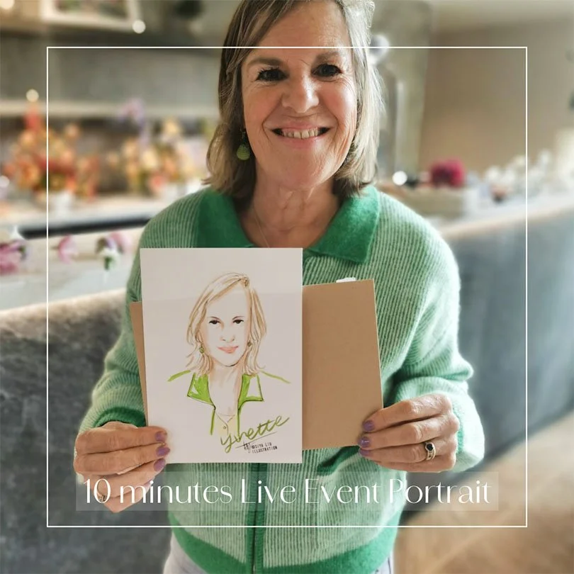 A short-haired lady wearing a bright green cardigan, holding a personalised fashion portrait illustrated by Siya Liu at a live event.  