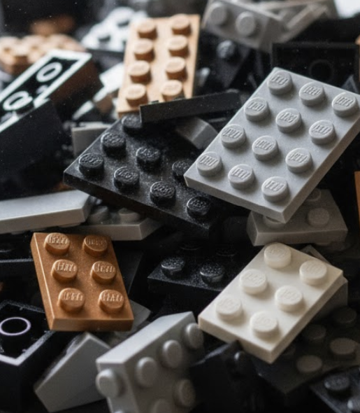 Close-up of various LEGO bricks in different colors and sizes.