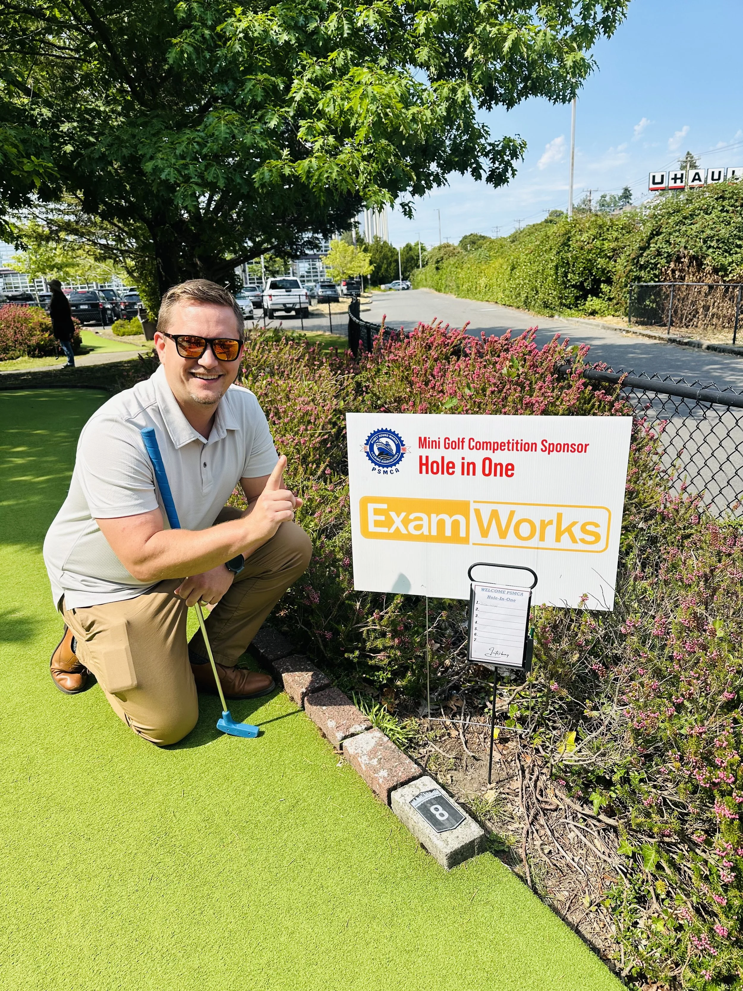 Drew Gillespie celebrates his Hole In One, sponsored by ExamWorks.