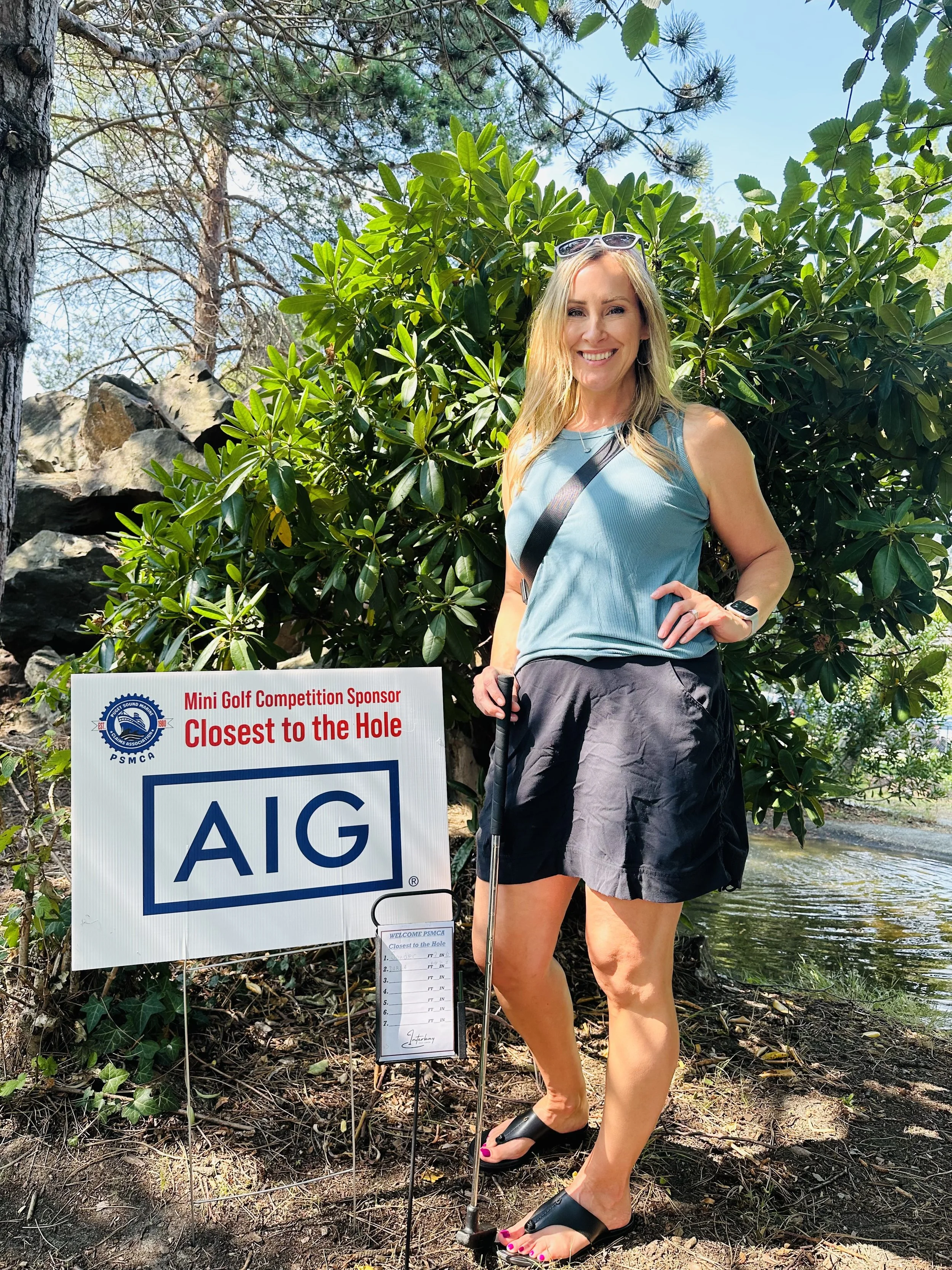Darla Sklar celebrates "Closest to The Hole" on the Putt Putt course, sponsored by AIG.