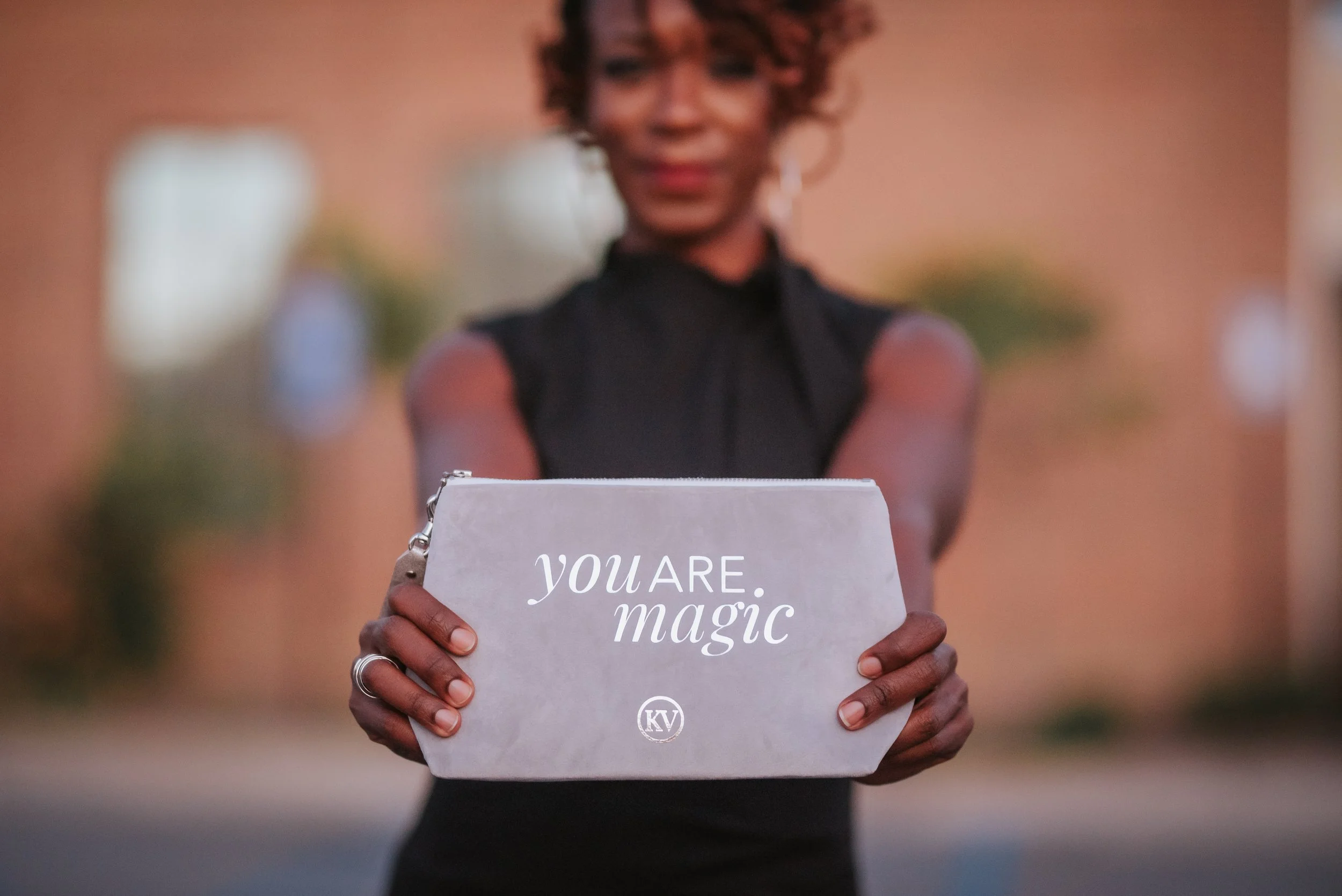 Sonia Toson hoding bag saying you are magic