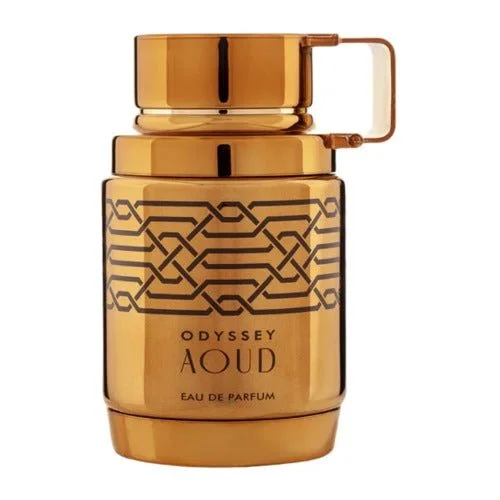 A gold-colored perfume bottle with the label 'Odyssey AQUD Eau de Parfum' and geometric design on the front.