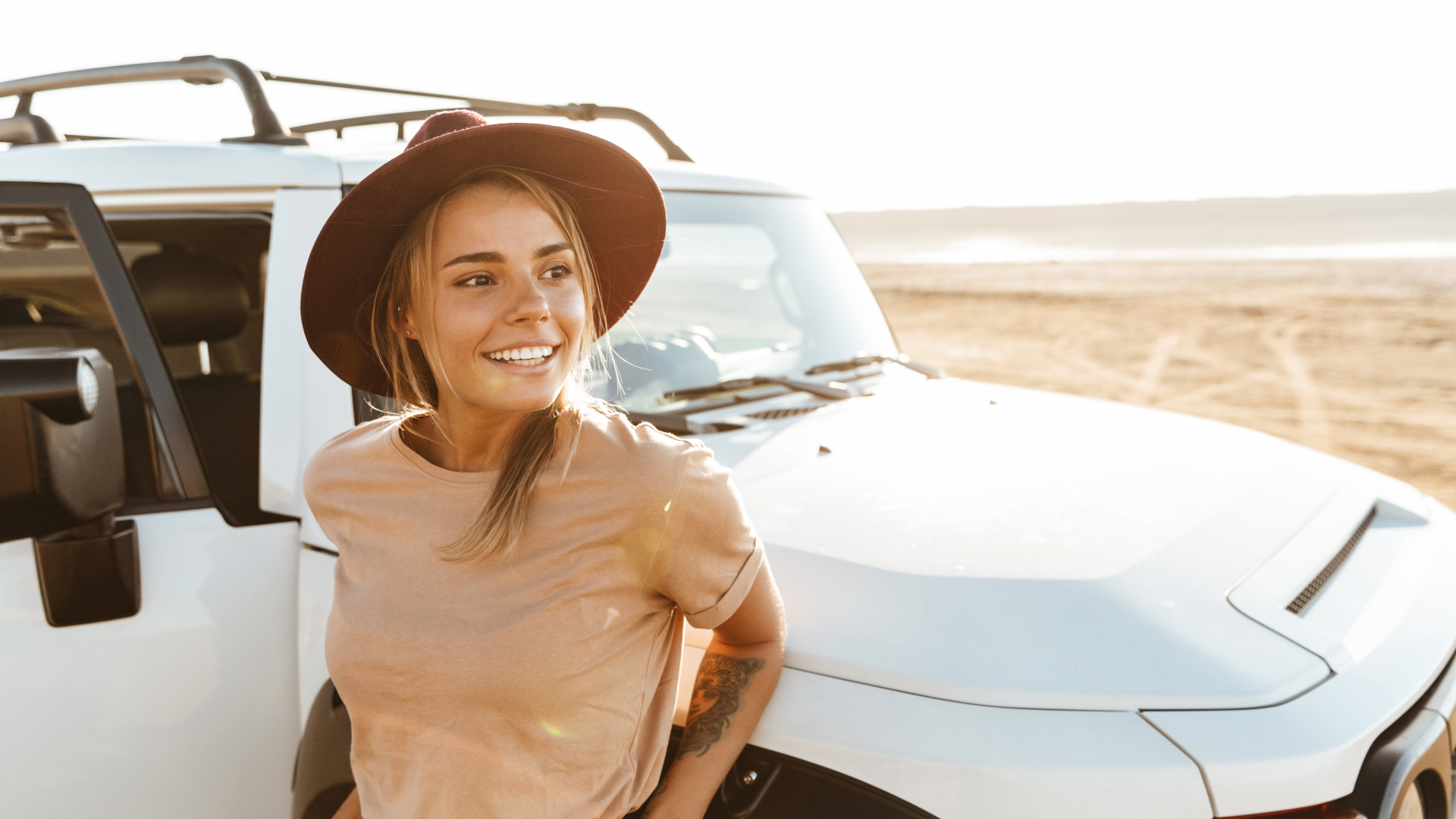 Girl at beach with Toyota FJ Cruiser