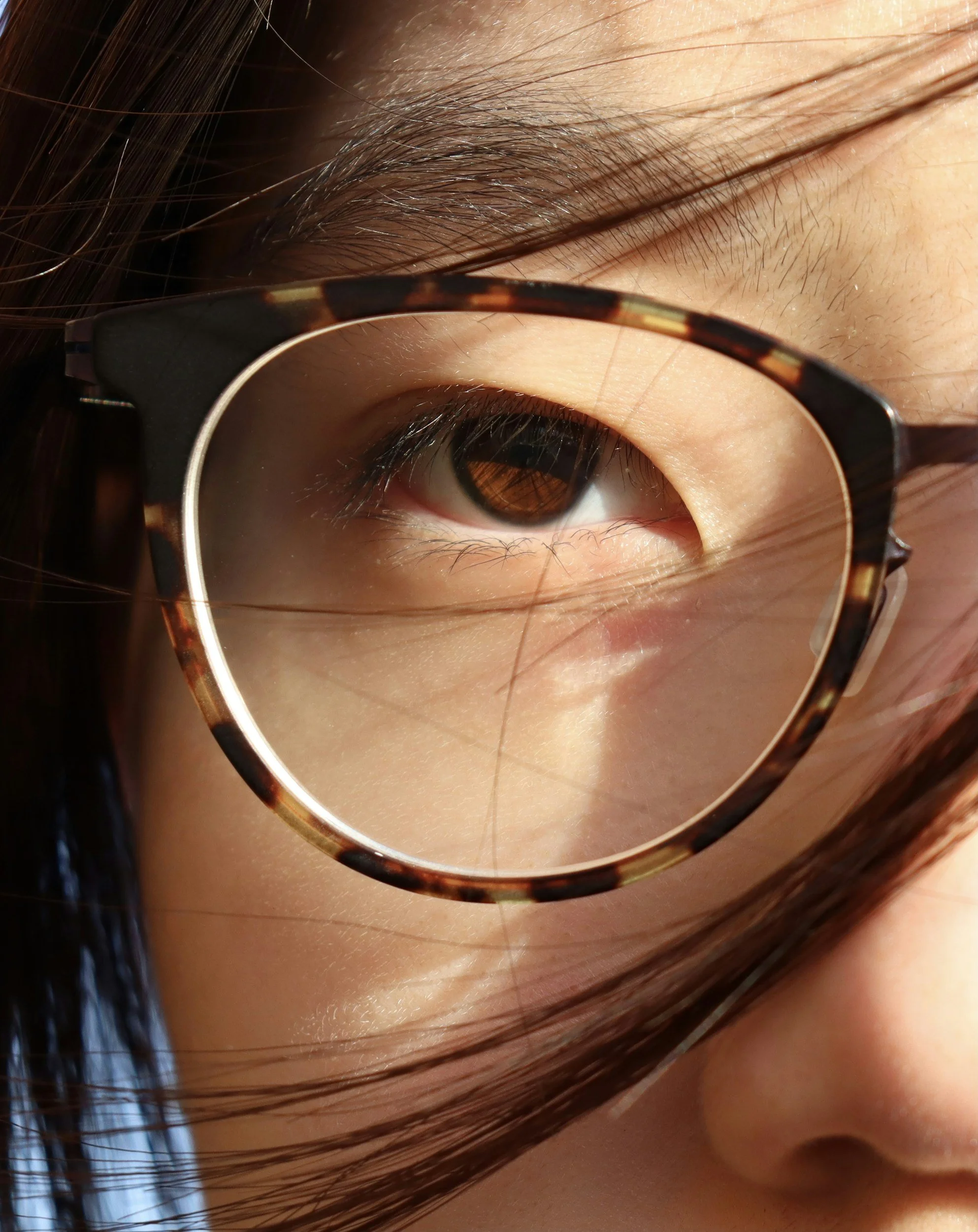 close up of woman wearing eyeglasses
