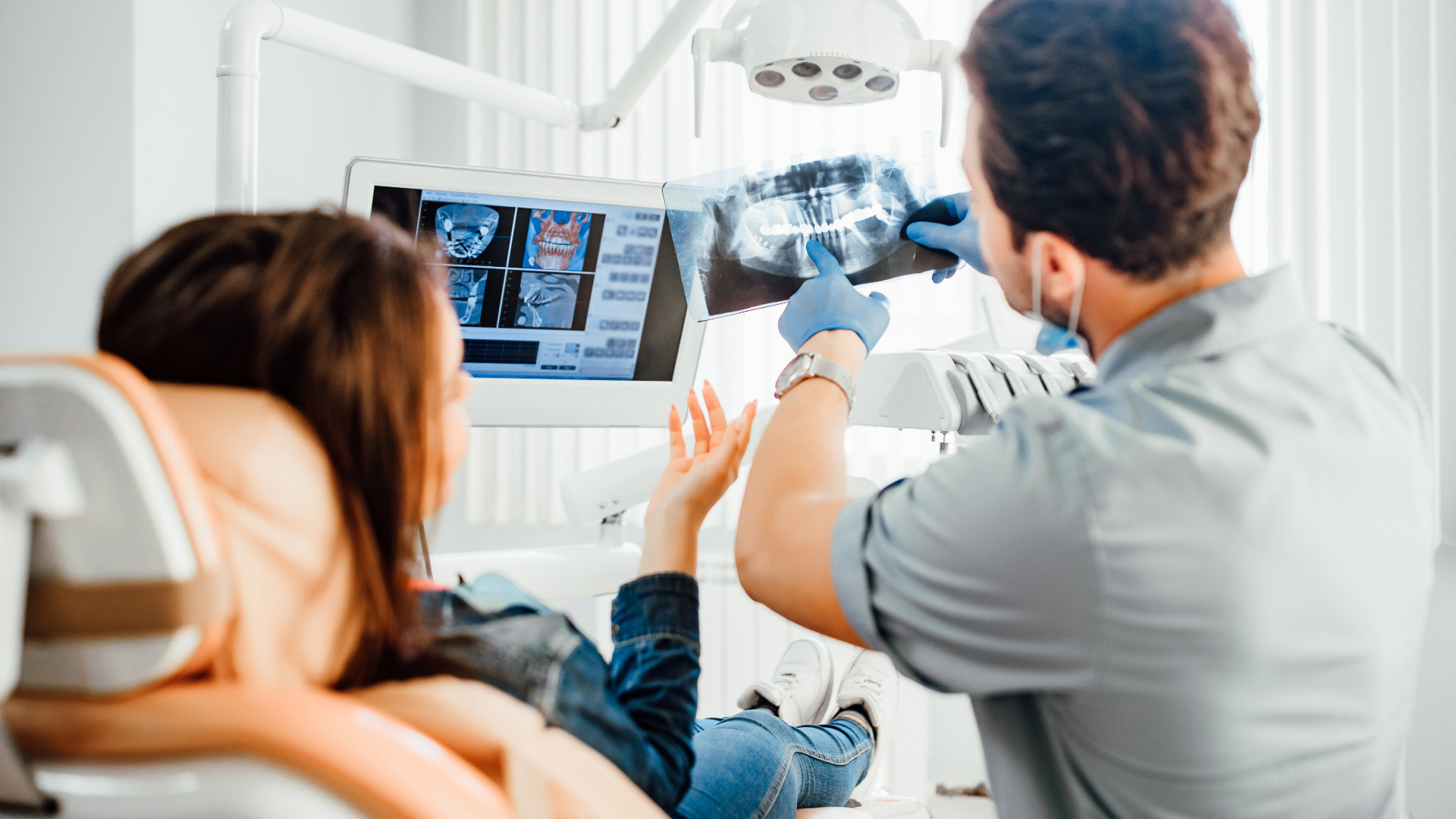 dentist showing xrays to patient