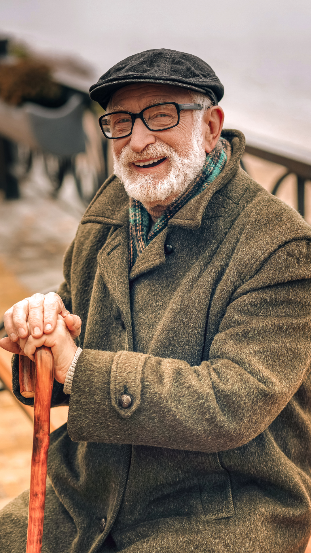 retired man with eyeglasses and a hat