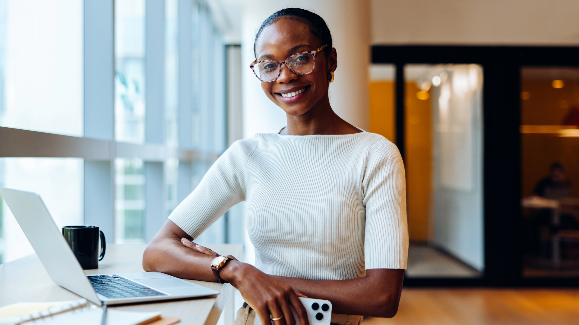 professional woman with laptop and cell phone