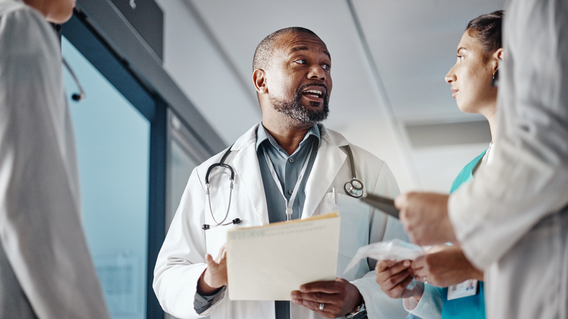 Doctor meeting with staff