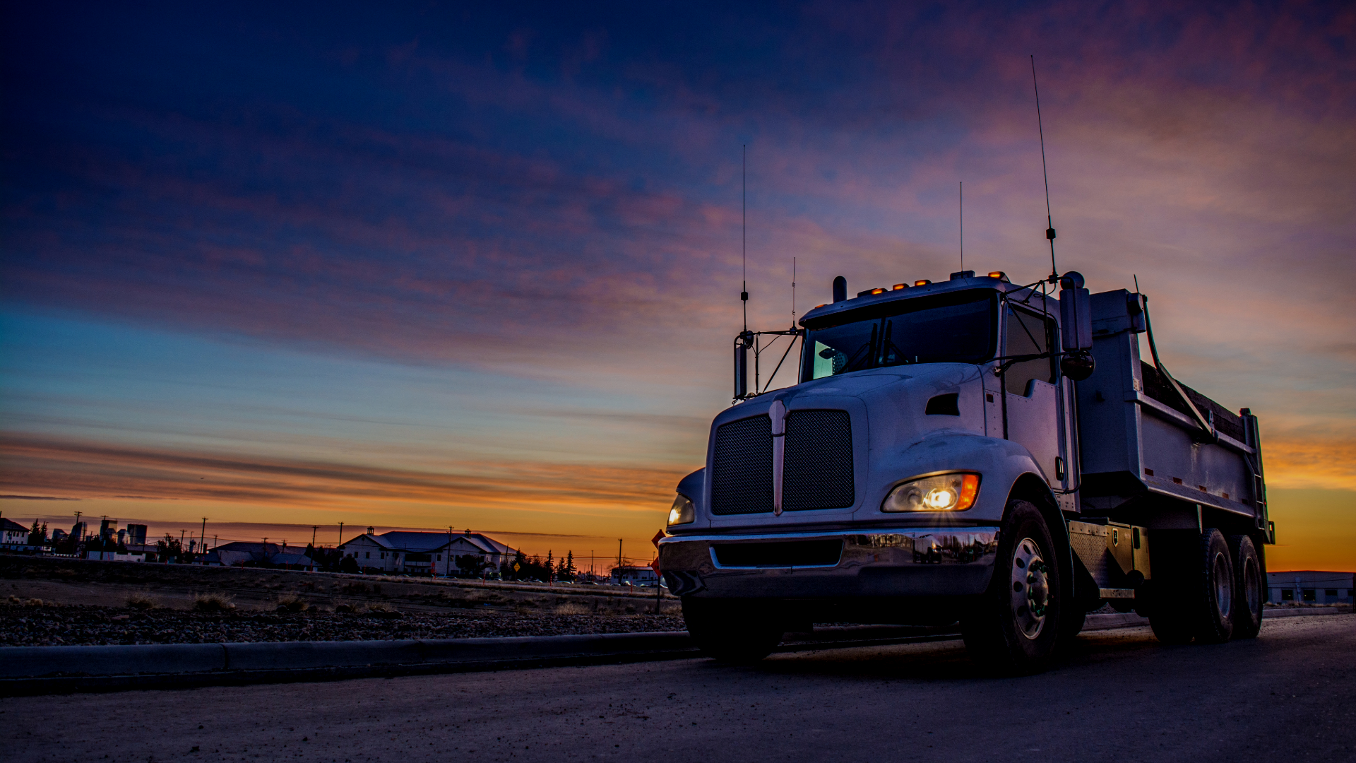 truck driving at sunset
